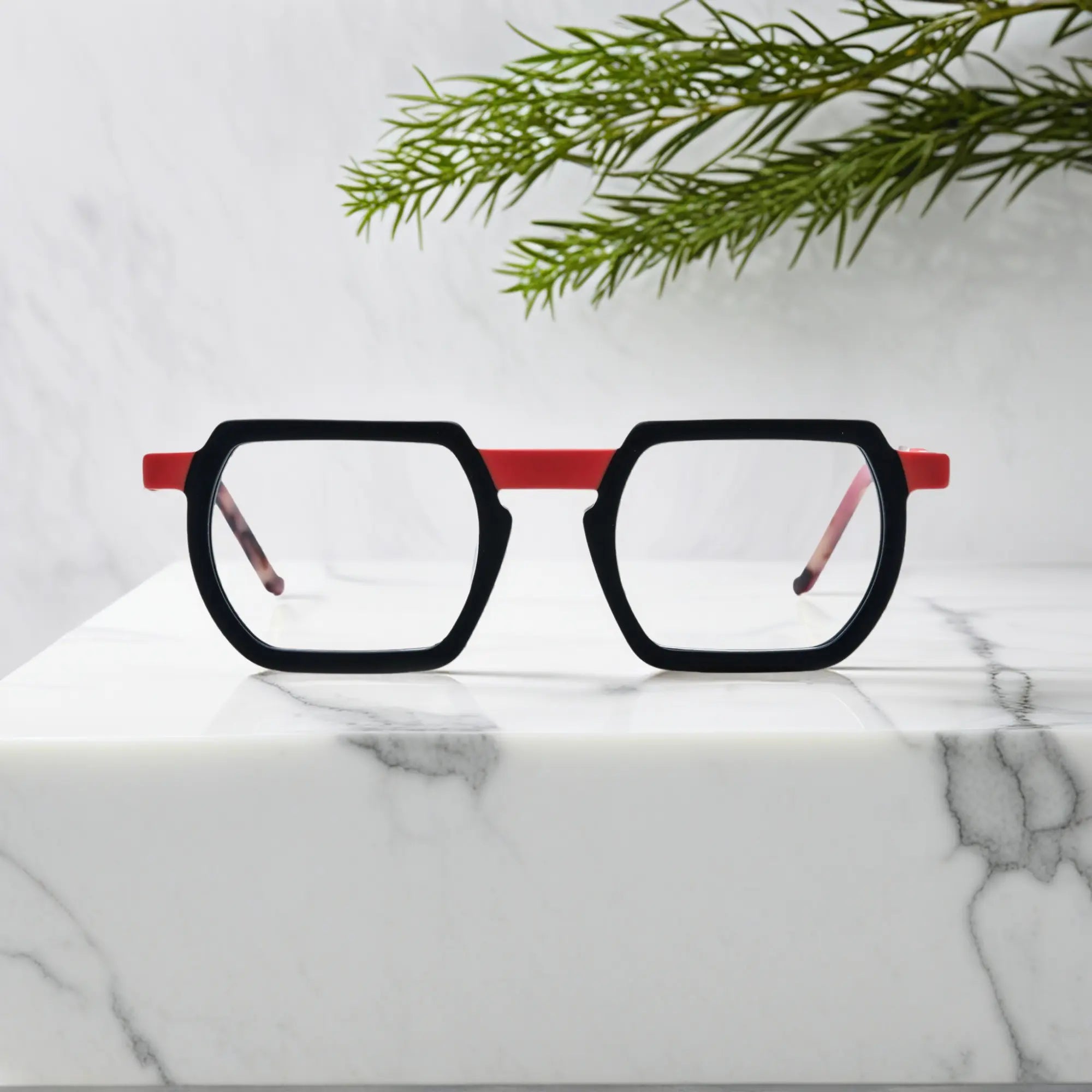 Front angle of VoyueLens™ Crimson Noir square frames in matte black with deep crimson accents